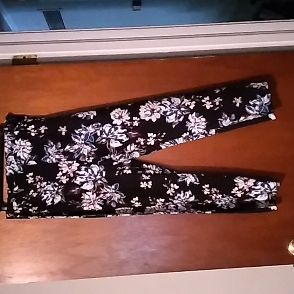 Black fitted pants with floral print